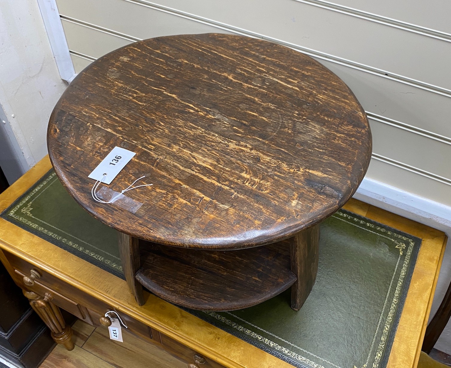 A provincial circular oak two-tier table, diameter 53cm, height 40cm